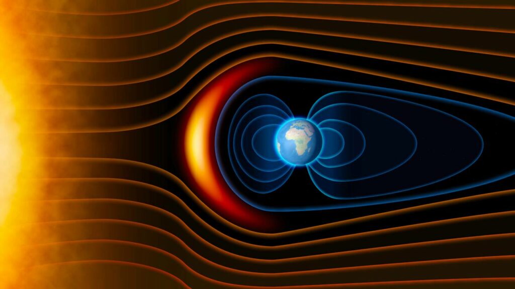 Concepção artística mostra o campo magnético da Terra protegendo o planeta de ventos solares - Créditos: depositphotos.com / vampy1