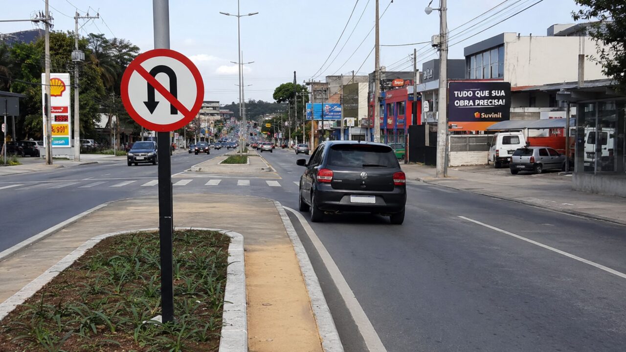 O que significa a placa de trânsito com fundo branco e uma seta curvada para baixo?