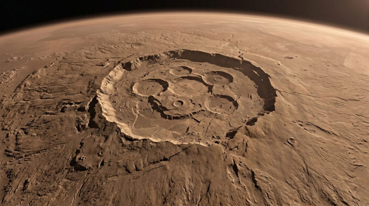 A caldeira e as encostas suaves de Olympus Mons registram longos períodos de atividade vulcânica concentrada no mesmo local